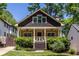 Charming bungalow featuring a cozy front porch, shingled gable, and well-maintained landscaping at 2628 White Oak Dr, Decatur, GA 30032
