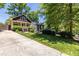 Charming home featuring well-manicured front lawn, driveway, and inviting porch with lovely curb appeal at 2628 White Oak Dr, Decatur, GA 30032