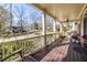 Spacious covered porch with a swing, ceiling fan, and views of the surrounding neighborhood at 2628 White Oak Dr, Decatur, GA 30032
