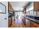 Well-lit kitchen boasting stainless steel appliances, granite countertops, and a breakfast nook at 2628 White Oak Dr, Decatur, GA 30032