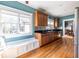Bright eat-in kitchen featuring a window bench, wooden cabinets, granite countertops, and stainless steel appliances at 2628 White Oak Dr, Decatur, GA 30032