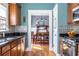 A well-lit kitchen space that features a dining room, backsplash, and stainless steel oven range at 2628 White Oak Dr, Decatur, GA 30032