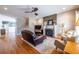 Cozy living room with hardwood floors, a fireplace, and comfortable seating at 2628 White Oak Dr, Decatur, GA 30032