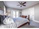 Comfortable main bedroom featuring a ceiling fan, plush carpet, and access to an outdoor deck at 2628 White Oak Dr, Decatur, GA 30032