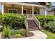 Inviting front porch with beautiful landscaping, offering a relaxing outdoor space at 2628 White Oak Dr, Decatur, GA 30032