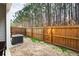 Fenced backyard offers privacy, with trees visible behind the fence at 353 Franklin Ln, Acworth, GA 30102