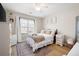 Cozy bedroom with a comfortable bed, stylish decor, and a large window at 353 Franklin Ln, Acworth, GA 30102