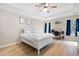 Spacious bedroom boasts a tray ceiling, ceiling fan, and plenty of natural light at 353 Franklin Ln, Acworth, GA 30102