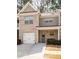 Charming townhome featuring a brick facade, single-car garage, and inviting front entrance at 353 Franklin Ln, Acworth, GA 30102