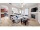 Open-concept living room with fireplace, kitchen view, and modern furnishings for a welcoming space at 353 Franklin Ln, Acworth, GA 30102