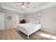 Light and airy main bedroom with tray ceiling, ceiling fan and ensuite bath at 353 Franklin Ln, Acworth, GA 30102