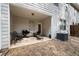 Covered outdoor patio, perfect for relaxing and entertaining, with chairs and a grill at 353 Franklin Ln, Acworth, GA 30102