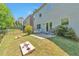 Backyard featuring a small patio and a lush lawn, ideal for outdoor enjoyment and entertainment at 3455 Flycatcher Way, Duluth, GA 30097