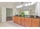 Bathroom with dual sinks and granite countertops at 3455 Flycatcher Way, Duluth, GA 30097