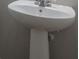 Bathroom with pedestal sink and modern fixtures at 3455 Flycatcher Way, Duluth, GA 30097