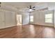 Spacious bedroom with hardwood flooring and a tray ceiling at 3455 Flycatcher Way, Duluth, GA 30097