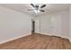 Bedroom highlighting a ceiling fan, hardwood floors, and dual closets at 3455 Flycatcher Way, Duluth, GA 30097