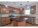 Modern kitchen featuring stainless steel appliances, granite countertops, and ample cabinet space at 3455 Flycatcher Way, Duluth, GA 30097