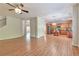 Open living space featuring a spacious kitchen, hardwood floors, and plenty of natural light at 3455 Flycatcher Way, Duluth, GA 30097