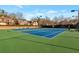 Outdoor community tennis courts with well-maintained surfaces and lighting for evening play at 3455 Flycatcher Way, Duluth, GA 30097