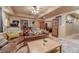 Cozy basement living area with plush sectional sofa and access to bonus rooms and updated flooring at 3828 Morning Meadow Ln, Buford, GA 30519