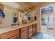 Bathroom showcasing double sinks, a large mirror, and neutral decor at 3828 Morning Meadow Ln, Buford, GA 30519