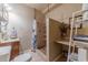 Cozy bathroom with shower featuring a stone floor at 3828 Morning Meadow Ln, Buford, GA 30519