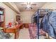 Versatile bedroom featuring a bunk bed, large desk, and ample storage; perfect for a shared space at 3828 Morning Meadow Ln, Buford, GA 30519