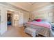 Inviting bedroom featuring vaulted ceiling and access to walk-in closet at 3828 Morning Meadow Ln, Buford, GA 30519
