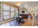 Cozy dining area with hardwood floors, large windows, and natural light at 3828 Morning Meadow Ln, Buford, GA 30519