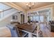 Bright dining area leading to the living room, featuring a rustic wood table at 3828 Morning Meadow Ln, Buford, GA 30519