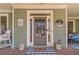 Charming front porch entrance with decorative accents, a welcoming mat, and classic curb appeal at 3828 Morning Meadow Ln, Buford, GA 30519