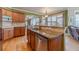 Well-appointed kitchen with granite countertops and seamless flow into the living area at 3828 Morning Meadow Ln, Buford, GA 30519