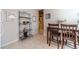 Charming kitchen nook with space saving shelving unit and modern decor at 3828 Morning Meadow Ln, Buford, GA 30519