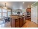 Well-lit kitchen with stainless steel appliances and granite countertops at 3828 Morning Meadow Ln, Buford, GA 30519