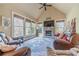 Inviting living room with vaulted ceilings, stone fireplace, and large windows at 3828 Morning Meadow Ln, Buford, GA 30519