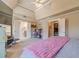 Bright main bedroom featuring vaulted ceiling and doorways to the main bathroom at 3828 Morning Meadow Ln, Buford, GA 30519