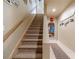 Carpeted staircase leading to the upper level of the home at 3828 Morning Meadow Ln, Buford, GA 30519