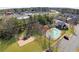 Aerial view of a community featuring a pool, playground, parking, and adjacent commercial development at 5034 Little Harbor Way, Acworth, GA 30101
