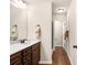Bathroom features dark wood cabinets, white countertops, and a walk-in shower at 5034 Little Harbor Way, Acworth, GA 30101