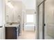 Bright bathroom with granite countertops, dark cabinets, and a glass-enclosed shower at 5034 Little Harbor Way, Acworth, GA 30101