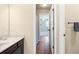 Bathroom featuring a dark wood cabinet, light countertop, with view of a bedroom at 5034 Little Harbor Way, Acworth, GA 30101