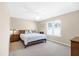 Cozy bedroom with a wooden bed frame, carpet, and natural light from the window at 5034 Little Harbor Way, Acworth, GA 30101