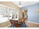 Dining area featuring wood table and chairs by window with view to front yard at 5034 Little Harbor Way, Acworth, GA 30101