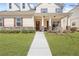 Charming two-story home with a welcoming front porch and well-manicured lawn at 5034 Little Harbor Way, Acworth, GA 30101