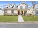 Charming two-story home with a welcoming front porch, well-maintained lawn, and stone accents at 5034 Little Harbor Way, Acworth, GA 30101