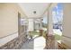 Inviting front porch with stone accents, comfortable seating, and charming neighborhood view at 5034 Little Harbor Way, Acworth, GA 30101