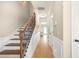 Hallway with wood floors and staircase at 5034 Little Harbor Way, Acworth, GA 30101