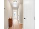 Hallway with wood floors and white doors leading to bedrooms and other rooms at 5034 Little Harbor Way, Acworth, GA 30101