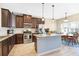 Kitchen featuring granite counters, stainless appliances, dark cabinetry, island and breakfast nook at 5034 Little Harbor Way, Acworth, GA 30101